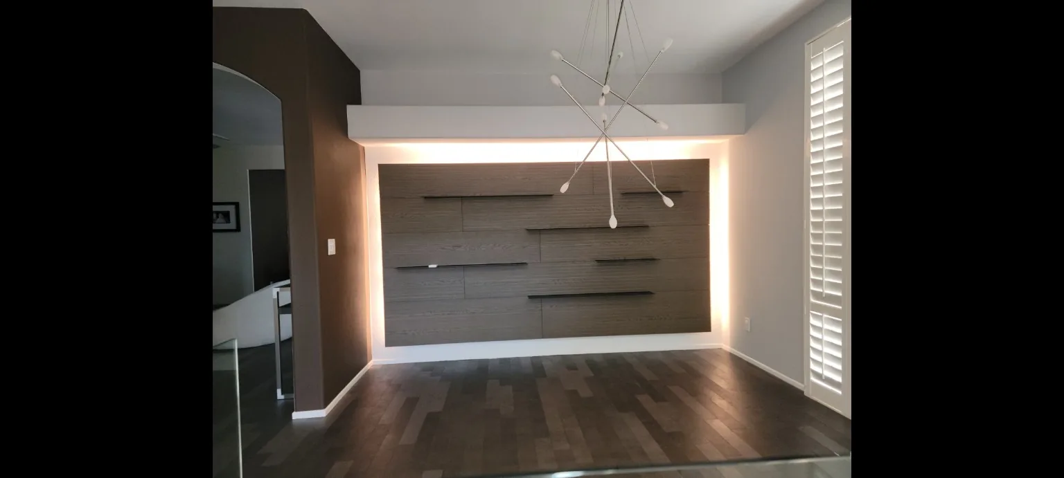 Custom illuminated built-in wall with shelves
